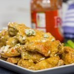 Baked crispy chicken wings.  That's right.  Baked!  These Blue Heat Baked Chicken Wings feature a tasty combination of buffalo sauce and homemade blue cheese dressing.