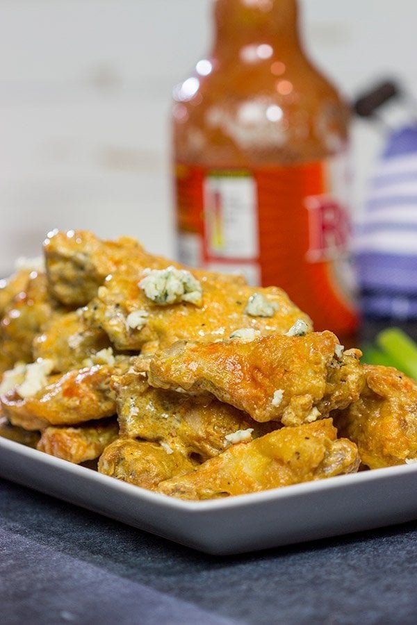 Baked crispy chicken wings.  That's right.  Baked!  These Blue Heat Baked Chicken Wings feature a tasty combination of buffalo sauce and homemade blue cheese dressing.