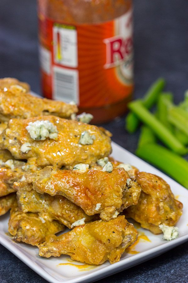 Baked crispy chicken wings.  That's right.  Baked!  These Blue Heat Baked Chicken Wings feature a tasty combination of buffalo sauce and homemade blue cheese dressing.
