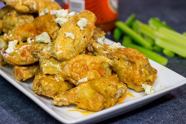 Baked crispy chicken wings.  That's right.  Baked!  These Blue Heat Baked Chicken Wings feature a tasty combination of buffalo sauce and homemade blue cheese dressing.