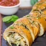 This Chicken Parm Stuffed Garlic Bread is 2 comfort food favorites in 1!  Crispy chicken and melty cheese stuffed inside garlicky, buttery bread.  Pass me a slice!