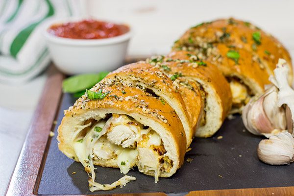 This Chicken Parm Stuffed Garlic Bread is 2 comfort food favorites in 1!  Crispy chicken and melty cheese stuffed inside garlicky, buttery bread.  Pass me a slice!