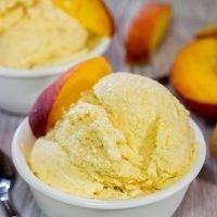 Is it a scorcher outside today? Cool off with ice cream! Celebrate peach season with a batch of this Homemade Peach Ice Cream!