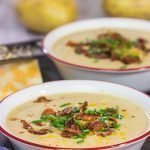 Loaded baked potato meets comforting creamy soup.  This Loaded Baked Potato Soup is a bowl of pure comfort food, and it's sure to keep you warm on cold winter nights!