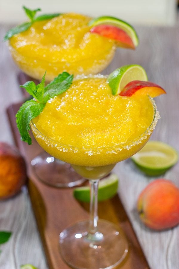 Grab the margarita glasses and celebrate warm summer evenings with a pitcher of these Peach Margaritas! Cheers!