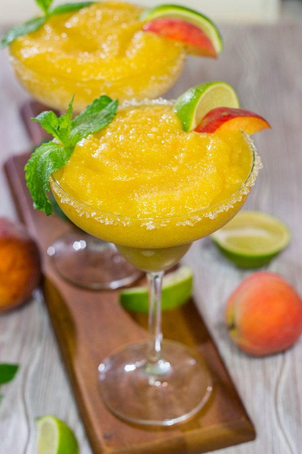 Grab the margarita glasses and celebrate warm summer evenings with a pitcher of these Peach Margaritas! Cheers!