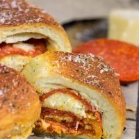 A cross between pizza and a sandwich, this Pepperoni Pizza Bundtwich is packed with flavor! It's the perfect gameday appetizer!