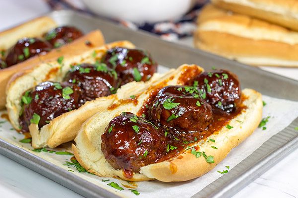 These Slow Cooker BBQ Meatball Subs are an easy and delicious comfort dinner.  Perfect for cold winter days!
