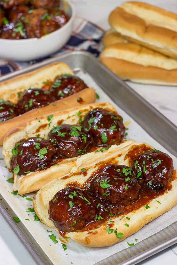These Slow Cooker BBQ Meatball Subs are an easy and delicious comfort dinner.  Perfect for cold winter days!