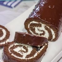 Filled with creamy whipped cream, this homemade Swiss Cake Roll is just like the one ate as a kid...but better!