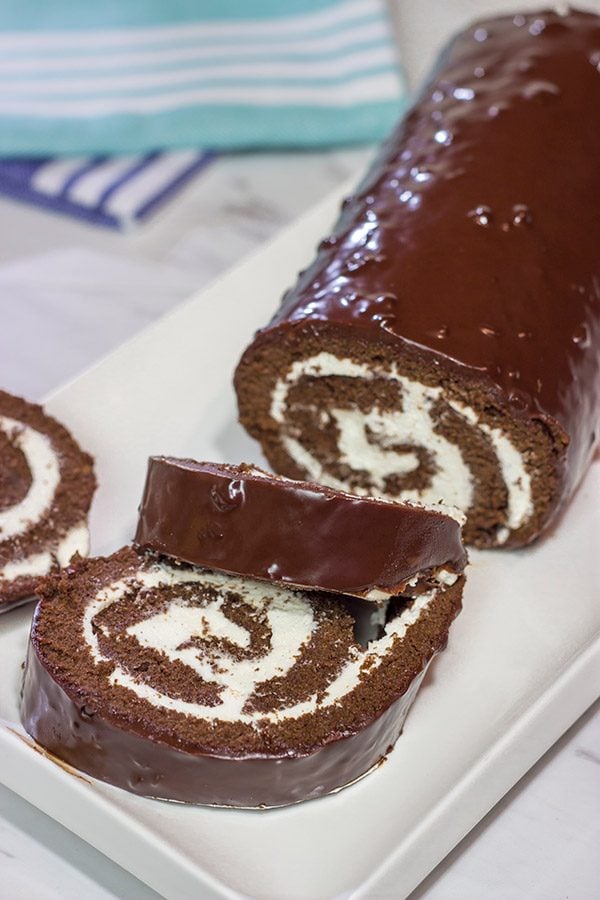 Filled with creamy whipped cream, this homemade Swiss Cake Roll is just like the one ate as a kid...but better!