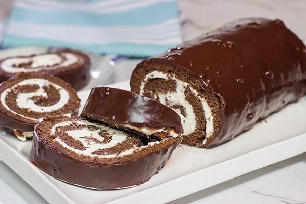 Filled with creamy whipped cream, this homemade Swiss Cake Roll is just like the one ate as a kid...but better!