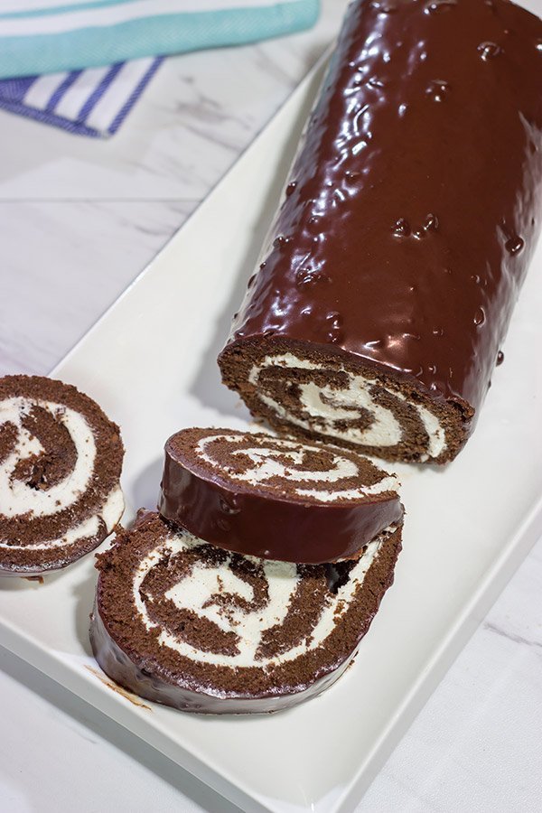 Filled with creamy whipped cream, this homemade Swiss Cake Roll is just like the one ate as a kid...but better!