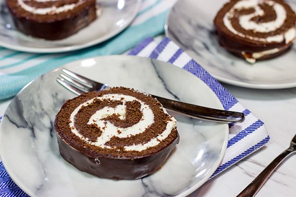 Filled with creamy whipped cream, this homemade Swiss Cake Roll is just like the one ate as a kid...but better!