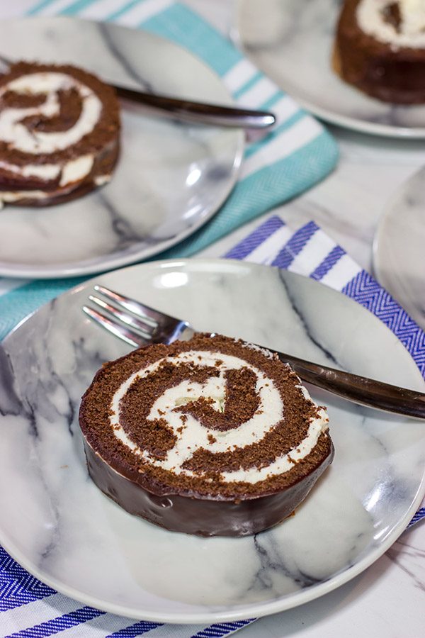 Filled with creamy whipped cream, this homemade Swiss Cake Roll is just like the one ate as a kid...but better!