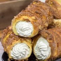 Trdelnik is a unique cinnamon sugar pastry found throughout Prague. Often filled with whipped cream and Nutella, Trdelnik are a delicious sweet treat!