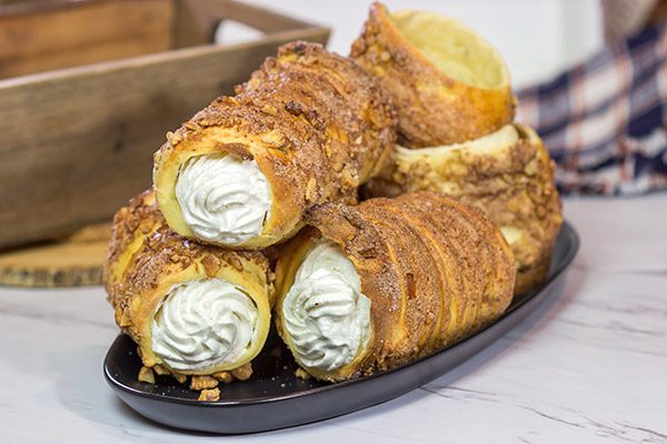 Trdelnik is a unique cinnamon sugar pastry found throughout Prague. Often filled with whipped cream and Nutella, Trdelnik are a delicious sweet treat!