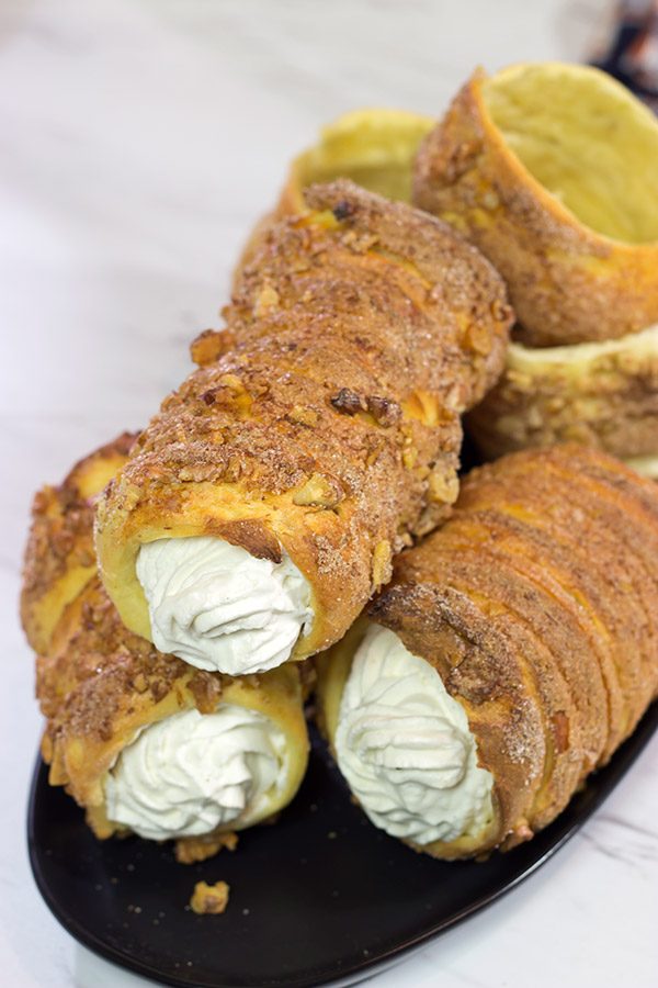 Trdelnik is a unique cinnamon sugar pastry found throughout Prague. Often filled with whipped cream and Nutella, Trdelnik are a delicious sweet treat!