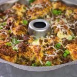 Packed with seasoned ground beef, bacon and two types of cheese, this Bacon Cheeseburger Monkey Bread makes for one heck of a delicious gameday appetizer!