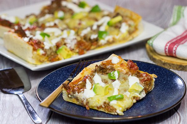 Make tonight a taco...err, pizza...night!  This Deep Dish Taco Pizza is a fun way to enjoy your favorite taco toppings in pizza form!