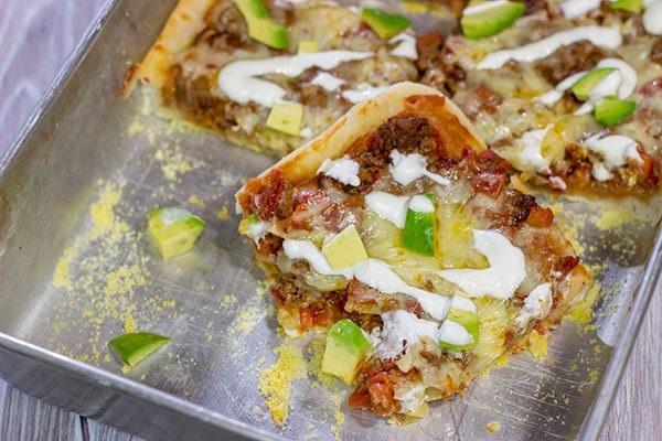 Make tonight a taco...err, pizza...night!  This Deep Dish Taco Pizza is a fun way to enjoy your favorite taco toppings in pizza form!