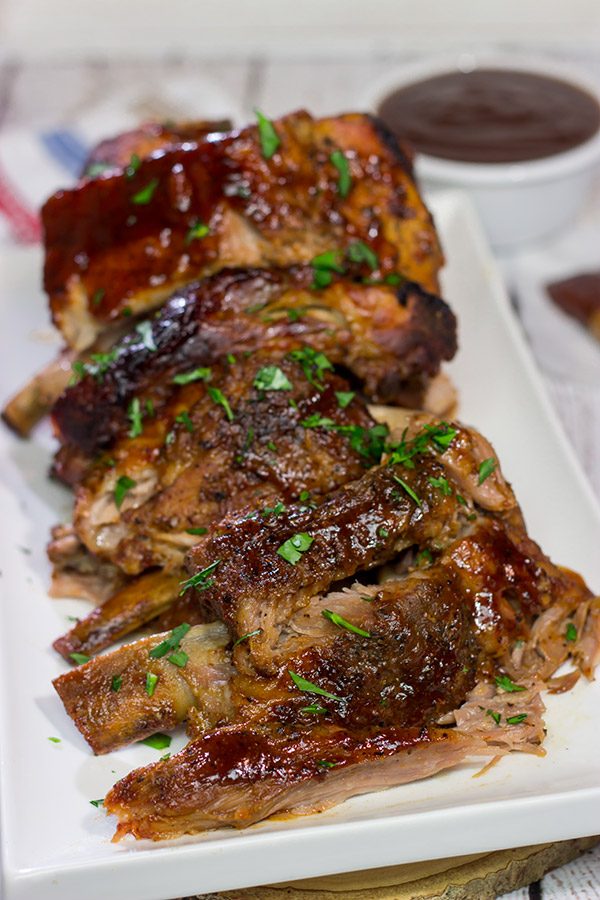 Too cold to pull out the grill?  Use the slow cooker instead!  These fall-off-the-bone Slow Cooker Baby Back Ribs are a delicious way to enjoy barbecue indoors!