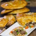 These Steak and Ale Hand Pies feature juicy sirloin steak tips simmered in dark beer.  Add in the flaky biscuit dough, and you've got one heck of a delicious cold weather comfort food!