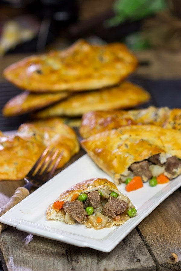 These Steak and Ale Hand Pies feature juicy sirloin steak tips simmered in dark beer.  Add in the flaky biscuit dough, and you've got one heck of a delicious cold weather comfort food!