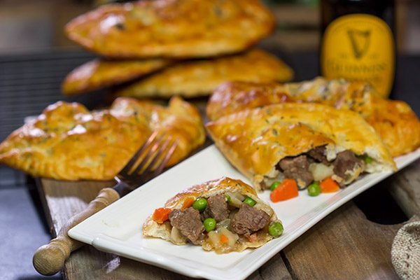 These Steak and Ale Hand Pies feature juicy sirloin steak tips simmered in dark beer.  Add in the flaky biscuit dough, and you've got one heck of a delicious cold weather comfort food!
