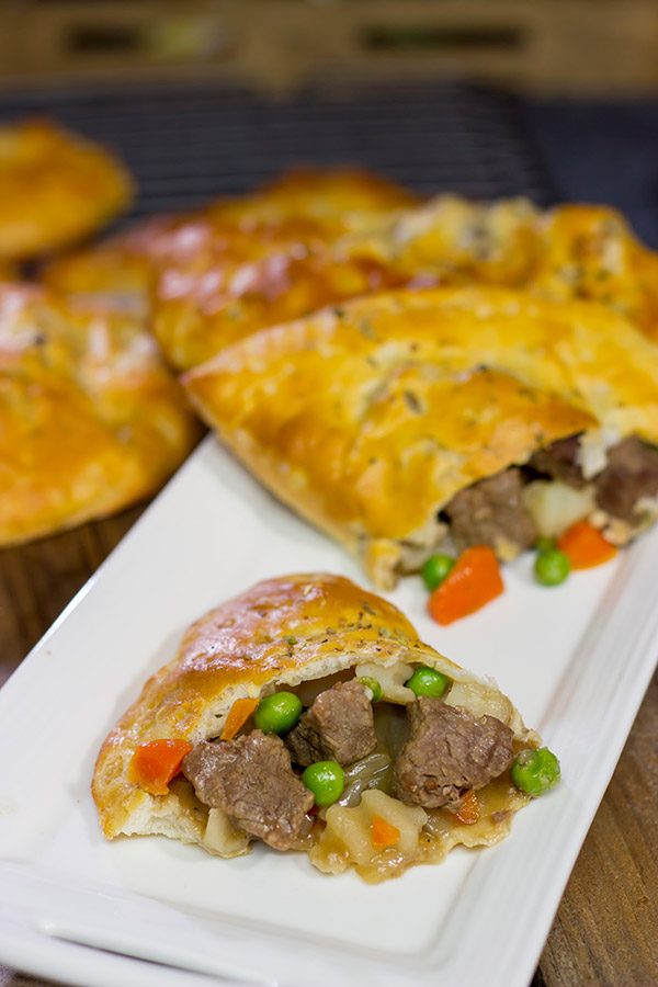 These Steak and Ale Hand Pies feature juicy sirloin steak tips simmered in dark beer.  Add in the flaky biscuit dough, and you've got one heck of a delicious cold weather comfort food!