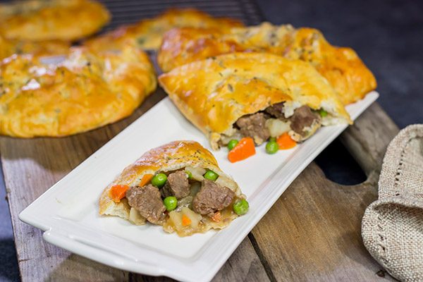 These Steak and Ale Hand Pies feature juicy sirloin steak tips simmered in dark beer.  Add in the flaky biscuit dough, and you've got one heck of a delicious cold weather comfort food!