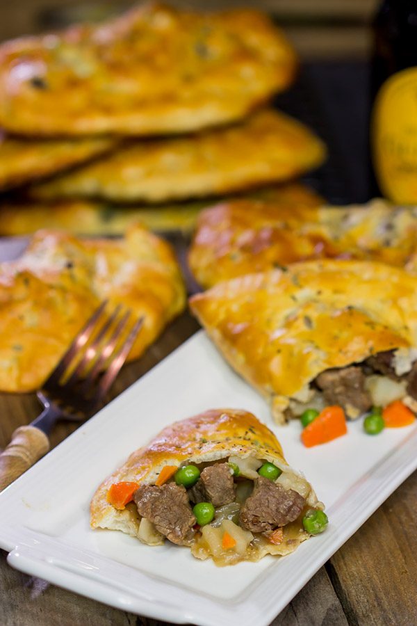 These Steak and Ale Hand Pies feature juicy sirloin steak tips simmered in dark beer.  Add in the flaky biscuit dough, and you've got one heck of a delicious cold weather comfort food!