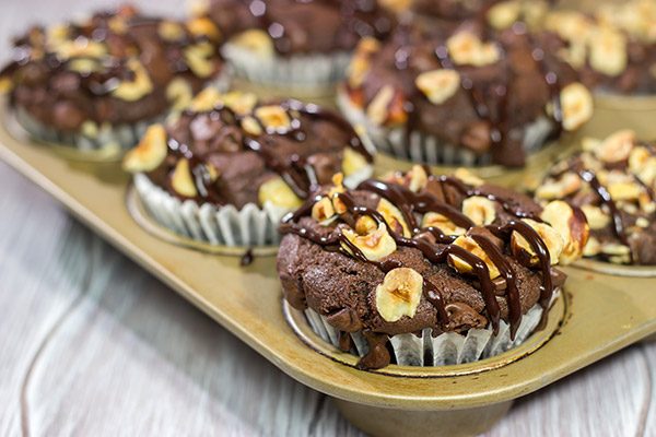 Topped with chocolate chips and chopped hazelnuts, these Chocolate Hazelnut Muffins make for an excellent morning...or afternoon...treat!