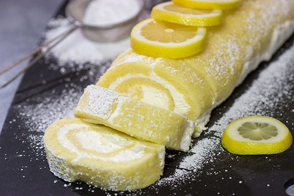 Filled with a whipped cream frosting, this Lemon Cake Roll is a fun dessert for warmer days!