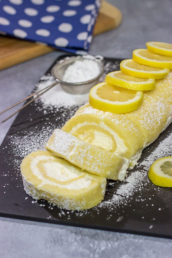 Filled with a whipped cream frosting, this Lemon Cake Roll is a fun dessert for warmer days!