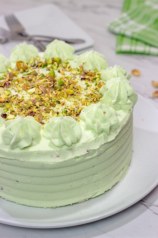 This Lemon Pistachio Cake uses pudding mix in both the cake and frosting for an extra creamy (and extra delicious) cake!