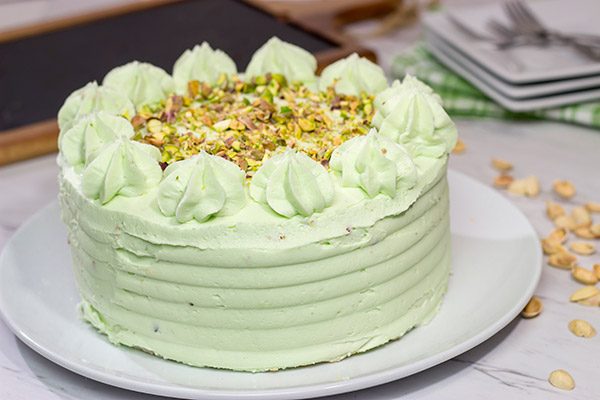 This Lemon Pistachio Cake uses pudding mix in both the cake and frosting for an extra creamy (and extra delicious) cake!