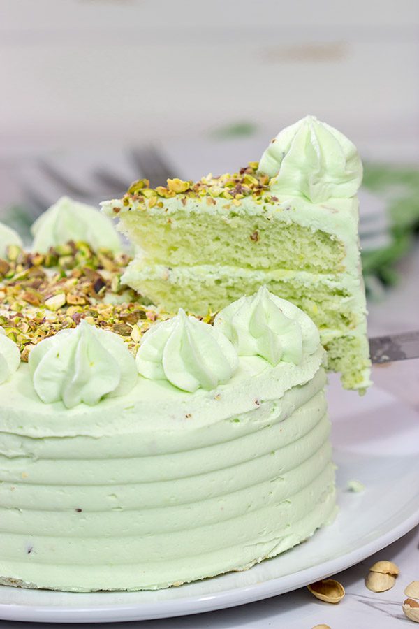 This Lemon Pistachio Cake uses pudding mix in both the cake and frosting for an extra creamy (and extra delicious) cake!
