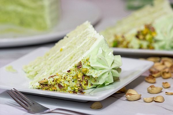This Lemon Pistachio Cake uses pudding mix in both the cake and frosting for an extra creamy (and extra delicious) cake!