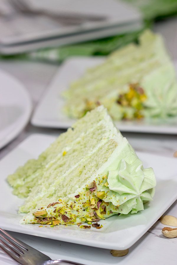 This Lemon Pistachio Cake uses pudding mix in both the cake and frosting for an extra creamy (and extra delicious) cake!