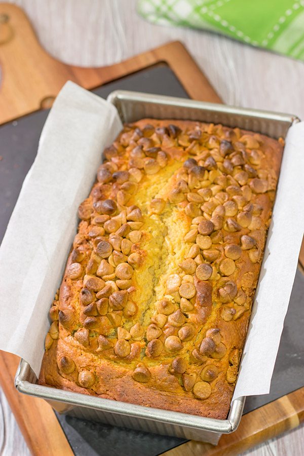 Topped with peanut butter baking chips, this Peanut Butter Bread is a moist cake-like quick bread that's perfect for snacking or dessert!