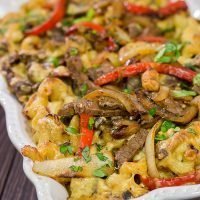Think mac and cheese is delicious?  Try adding thinly sliced steak, peppers and onions!  This Philly Cheesesteak Mac and Cheese is packed with flavor, and it's a definite favorite!