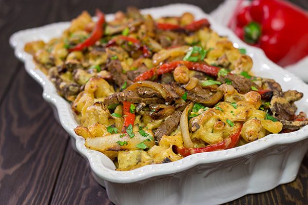 Think mac and cheese is delicious?  Try adding thinly sliced steak, peppers and onions!  This Philly Cheesesteak Mac and Cheese is packed with flavor, and it's a definite favorite!