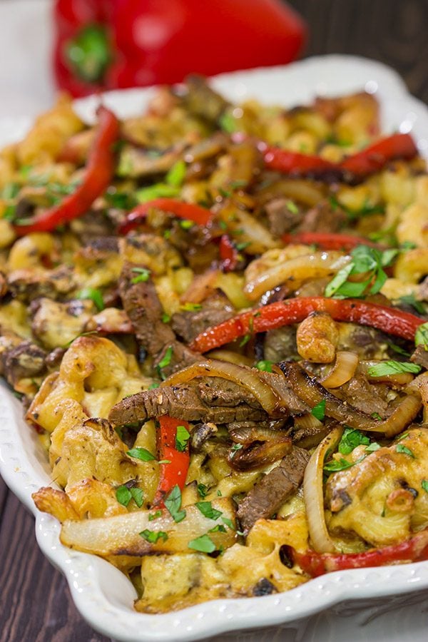 Think mac and cheese is delicious?  Try adding thinly sliced steak, peppers and onions!  This Philly Cheesesteak Mac and Cheese is packed with flavor, and it's a definite favorite!