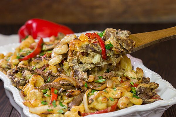 Think mac and cheese is delicious?  Try adding thinly sliced steak, peppers and onions!  This Philly Cheesesteak Mac and Cheese is packed with flavor, and it's a definite favorite!