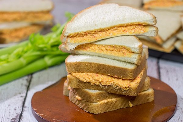 Pimiento Cheese Sandwiches are a classic Southern recipe.  These tasty sandwiches are incredibly easy to make, and they're an excellent choice for a fun party appetizer!