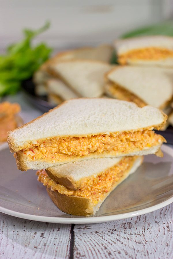 Pimiento Cheese Sandwiches are a classic Southern recipe. These tasty sandwiches are incredibly easy to make, and they're an excellent choice for a fun party appetizer!