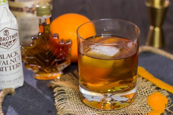 This Smoked Old Fashioned introduces maple syrup and smoke for a fun twist on a classic cocktail!