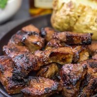 Looking for a fun marinade idea? Pull out the bottle of bourbon! These Bourbon Marinated Steak Tips make for a delicious (and easy) dinner idea!
