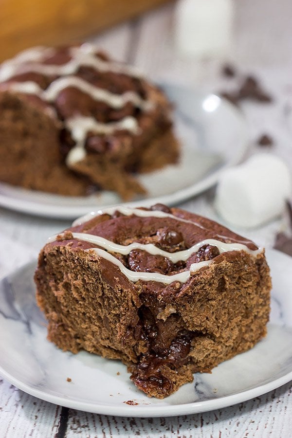 Inspired by two favorite winter recipes, these Hot Cocoa Cinnamon Rolls feature chocolaty rolls drizzled with a marshmallow glaze. They're perfect for cold winter days!